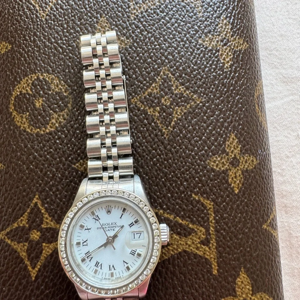 Rolex Silver Watch with White Dial and Diamond Bezel